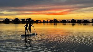 Two people paddling on Tchum Lakes, Birchip Victoria.